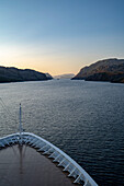 Midnight sun seen from a cruise ship in the fjords; Western Fjords, Norway