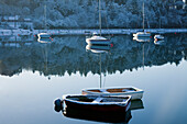 Boats Moored On Tranquil Water In The Winter; County Cork Ireland