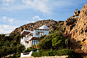 A House Against A Rock Cliff Near Zahara De Los Atunes; Andalusia Spain