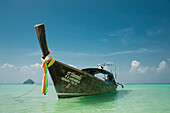 Long-Tail Boat With Mosquito Island In The Background; Phi Phi Islands Phuket Thailand