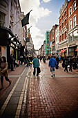 Pedestrians Walking On Grafton Street; Dublin Ireland