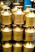 Nepal, Stack of shiny brass pots in Durbar Square; Kathmandu