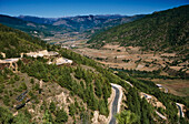 Bhutan, Winding roads on hillside in rural landscape; Bumthang Valley