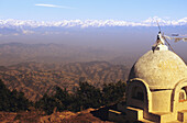View of central himalayan mountain range from Mount Phulchowski and small white stupa in foreground; Nepal