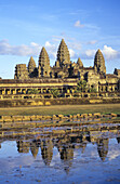 Cambodia, Siem Reap, Temple reflecting in pond; Angkor Wat
