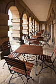 Chairs And Tables In An Outdoor Corridor; Northumberland England