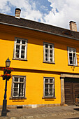 A Painted Yellow Building In The Castle District; Budapest Hungary