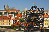 Bronze Relief On Charles Bridge Or Karluv Most With Royal Palace In The Background; Prague Czech Republic