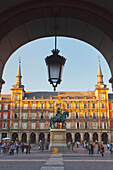Equestrian Statue Of King Felipe Iii In The Busy Plaza Mayor; Madrid Spain