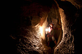 A Filipino Tour Guide Holds A Lantern Inside Sumaging Cave Or Big Cave Near Sagada; Luzon Philippines