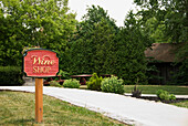 Wooden Wine Shop Sign At The Entrance Of A Winery; St. Catharines Ontario Canada