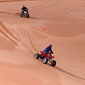 Riding Quads On Sand Dunes; Utah United States Of America