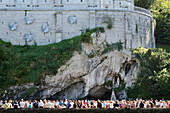 Crowd Gathered At The Sacred Grotto Sanctuary Of Our Lady Of Lourdes; Lourdes Hautes-Pyrenees France