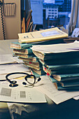 Stack of Folders on Table in Doctor's Office