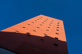 Low Angle View of Shadow on Red Brick Building against Blue Sky, Madrid, Spain