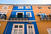 Low Angle View of Colorful Building Exteriors with Paned Windows and Small Balconies, Valencia, Spain