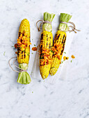 Barbecued corn cobs with lime butter