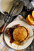 American pancakes with bacon and orange syrup