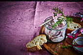 A soused herring salad in a jar