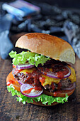 Classic cheeseburger with lettuce, tomatoes and onions