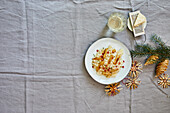 Risotto with black salsify and pomegranate seeds for Christmas