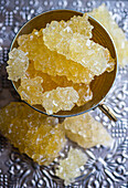 Iranian crystal rock candy in a vintage metal bowl