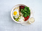 Colourful bowl with quinoa and fried egg