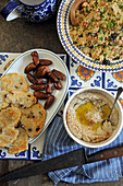 Couscous with hummus, pita bread and dates