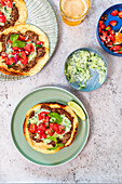 Smash tortillas with lamb burger, tzatziki and tomato salad