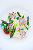 Green and white asparagus tips with truffles
