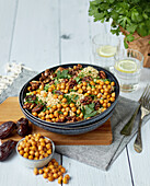 Couscous salad with roasted chickpeas, dates and nuts