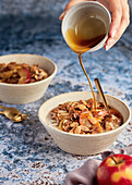 Porridge with roasted apple slices, cinnamon and almonds
