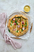 Galette with young carrots, asparagus, radishes, garlic and cheese