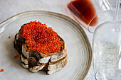 Sourdough bread with red salmon caviar
