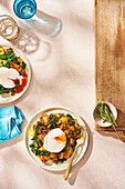Potato hash with vegetables and poached egg