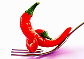Red chillies on fork