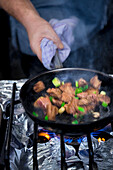 Beef cubes cooking in a pan
