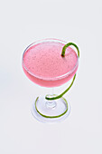 Pink Cosmopolitan with lime zest