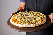 Pizza with green olives