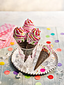 Unicorn ice cream in a waffle cone
