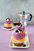 Cupcakes with blueberry topping and coconut shavings