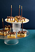 Cheesecake with chocolate icing on a stick