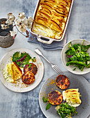 Leafy coconut potato gratin with curried turnip steaks