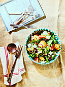 Panzanella with melon and goat cheese