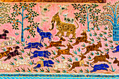 Laos, Luang Prabang. Mosaic mural depicting animals.