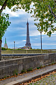 Paris. Eiffel Tower in territorial and street view.