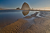 USA, Oregon. Cannon Beach with Haystack near sunset and low tide.