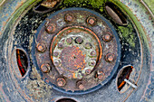 USA, Oregon, Tillamook. Close-up of old and rusted painted truck wheels