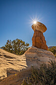 USA, Utah, Devil's Garden Outstanding Natural Area. Sun starburst on hoodoo rock formations.