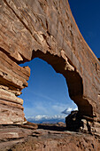 USA, Utah. Jeep Arch and clouds near Moab